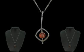 A Art Nouveau Style Silver Drop Pendant, set with amber coloured stone, attached to a fine silver