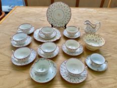 Lustre Tea Set Circa 1840, comprising milk jug, sugar bowl, eight cups, seven saucers, and two bread