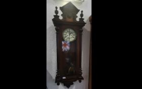 A Late 19th Century Gustav Becker Two Weight Walnut Vienna Wall Clock with cream chapter dial, Roman