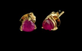 Ruby Trillion Style Stud Earrings, the rich red rubies, heart cut within trillion proportions, set