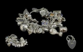 Heavy Mid Century Silver Charm Bracelet, loaded with lots of interesting charms including