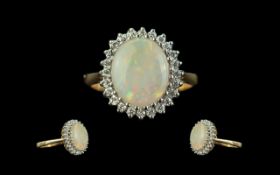 Ladies - Attractive 9ct Gold Opal and Diamond Set Cluster Ring. The Large Oval Shaped Opal of Good