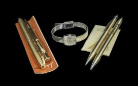 A Collection Of Pens and Pencils comprising of a Cross pen and pencil set, a rolled gold plated