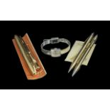 A Collection Of Pens and Pencils comprising of a Cross pen and pencil set, a rolled gold plated