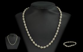 A Sterling Silver Fancy Link Necklace and Bracelet Set. Marked 925 to clasp. Very good condition.