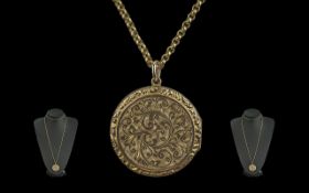 Antique Period 9ct Gold Circular Double Photo Locket with Chased Decoration and Vacant Cartouche.