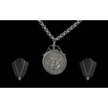 1964 Half Dollar set in pendant with silver mount, set on a 22'' belcher chain.