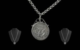 1964 Half Dollar set in pendant with silver mount, set on a 22'' belcher chain.