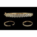 Ladies - Superb Quality 18ct Gold Diamond Set Hinged Bangle. The Step-cut and Brilliant Cut Diamonds