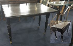 A Painted Pine Pembroke Table of typical form, firm supports, and brass casters. Height 30 inches,