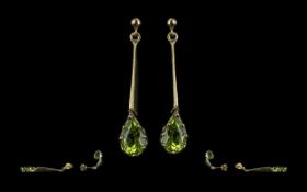 Fine Pair of Attractive 9ct Gold Drop Earrings, set with tear drop peridots;, marked 9ct, the