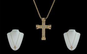 18ct Gold Cross Set With Diamonds, attached to an 18ct gold chain, both marked 750 - 18ct, the