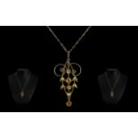 Edwardian Citrine Set Pendant suspended on a 9ct gold chain, a superbly designed antique gold