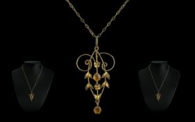 Edwardian Citrine Set Pendant suspended on a 9ct gold chain, a superbly designed antique gold