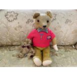 Vintage Busy Bear Teddy, moveable limbs, wearing a red sweater and bow tie. Measures 20'' high.