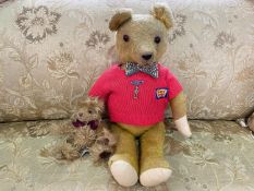 Vintage Busy Bear Teddy, moveable limbs, wearing a red sweater and bow tie. Measures 20'' high.