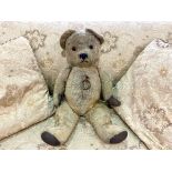 Early 20th Century Teddy Bear. Jointed straw filled bear, padded paws, glass eyes. Approx. 22''