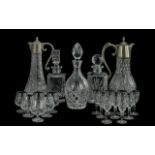 Quantity of Quality Glass Ware, comprising three decanters with stoppers, two water jugs with pewter