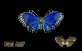 Large Antique Enamel on Silver Butterfly Brooch, a silver butterfly with vibrant blue enamel