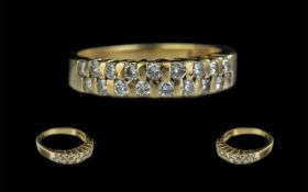 18ct Gold - Attractive Double Line Diamond Set Ring of Pleasing Design. Set with 18 Round Diamonds