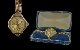 Rolex Ladies 9ct Gold Cased Six Sided Mechanical Wrist Watch, with 9ct Gold expanding bracelet. Both