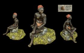 Austrian Cold Painted Bronze Figure of an Indigenous African Man Resting on a Stone, a superbly
