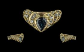 18ct Sapphire & Diamond Ring, pear shaped sapphire set between round brilliant cut diamonds, stamped