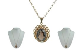 Ladies 9ct Gold Attractive Smoky Topaz and Pearl Set Pendant attached to a 9ct gold fancy chain,