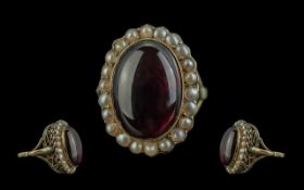 Victorian Period 1837 - 1900 18ct Gold - Etruscan Revival Garnet and Pearl Set Ring. The Etruscan