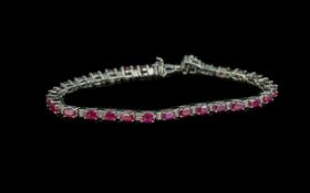 Ruby Tennis Bracelet, oval cut rubies, of rich red colour with pinkish undertones, totalling