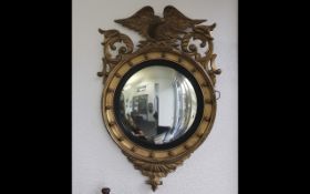 Empire Style Mirror, circular form, surmounted with an eagle, gilt plaster. Measures height 40''.