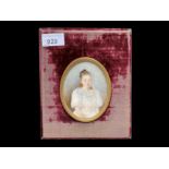 Early 20th Century Portrait Miniature, depicts a young girl in lace dress, housed in a velvet