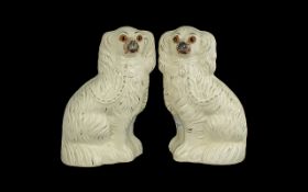 A Pair of Staffordshire Dogs with Glass Eyes Height 11 inches.
