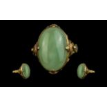 Chinese 20ct Gold Single Stone Jade Set Ring, Chinese marks to interior of shank; the oval shape