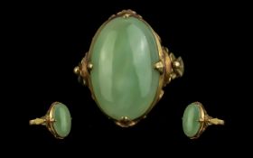 Chinese 20ct Gold Single Stone Jade Set Ring, Chinese marks to interior of shank; the oval shape