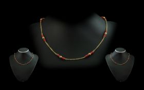 18ct Gold and Coral Necklace. Marked 18ct 750. Excellent Coloured Coral. Weight 5,8 grams. Length 16