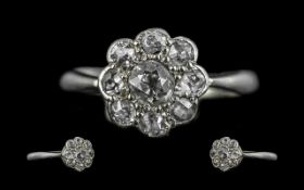 Ladies Platinum Diamond Set Ring, flowerhead design, central diamond cushioned old cut surrounded by