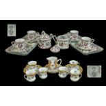 Elias Cabaret Set, comprising four cups and saucers, two lidded sugar bowls and two porcelain trays,