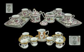 Elias Cabaret Set, comprising four cups and saucers, two lidded sugar bowls and two porcelain trays,