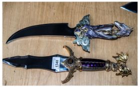 Two Heavy Good Quality Fantasy Oriental Decorative Display Daggers, one with a handle depicting a