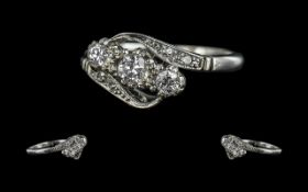 18ct White Gold Attractive 3 Stone Diamond Set Ring. Not Marked but Tests 18ct Gold. The 3 Round