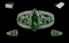 Ladies Green Tourmaline Ring, set in silver with CZ to the shoulders; a Joancee designer ring set