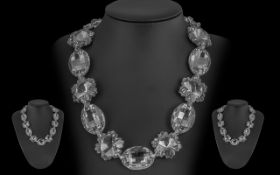 Butler and Wilson Statement Crystal Necklace. Comprising of 11 stones alternating between oval and