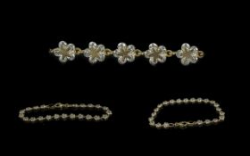 Ladies 9ct Gold Tennis Bracelet with flower head design. Total weight 6.3 g. Measures 7.5 inches