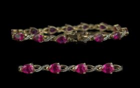Ladies Attractive 9ct Gold Ruby and Diamond Set Line Bracelet, full hallmark for 9.375, good