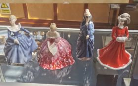 Four Lady Figurines, comprising Royal Doulton 'Fragrance' HN 2334, Royal Doulton 'Masque' HN 2554,