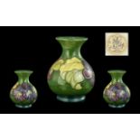 Moorcroft Vase, measures 5.5'' high, Hibiscus vase, of baluster form, yellow, purple and red flowers