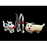 Three Lorna Bailey Figures, comprising a 3.5'' x 6'' dog in creamy yellow, a black and white howling