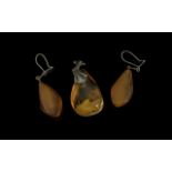 Pair of Butterscotch Amber Drop Earrings plus a similar, amber pear drop shaped pendant; the lozenge