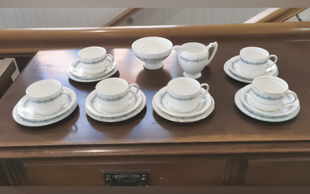 Coalport Tea Service, comprising six cups, saucers and side plates, a milk jug and sugar bowl. White